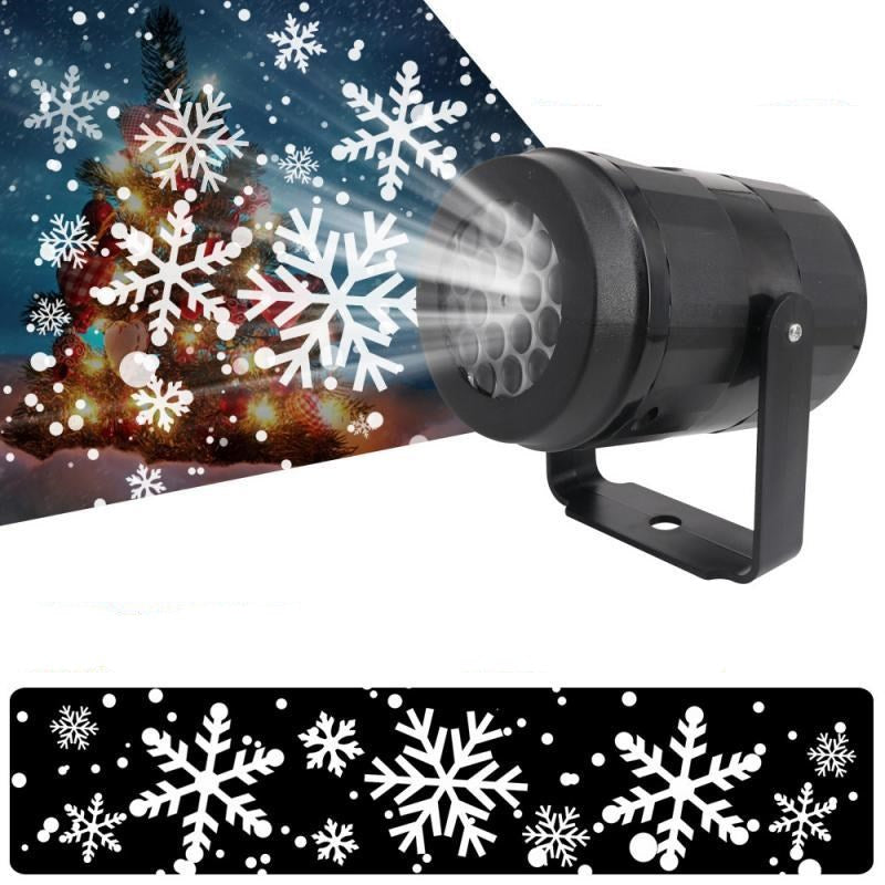 Snöflingeprojektor lyser på husfasad