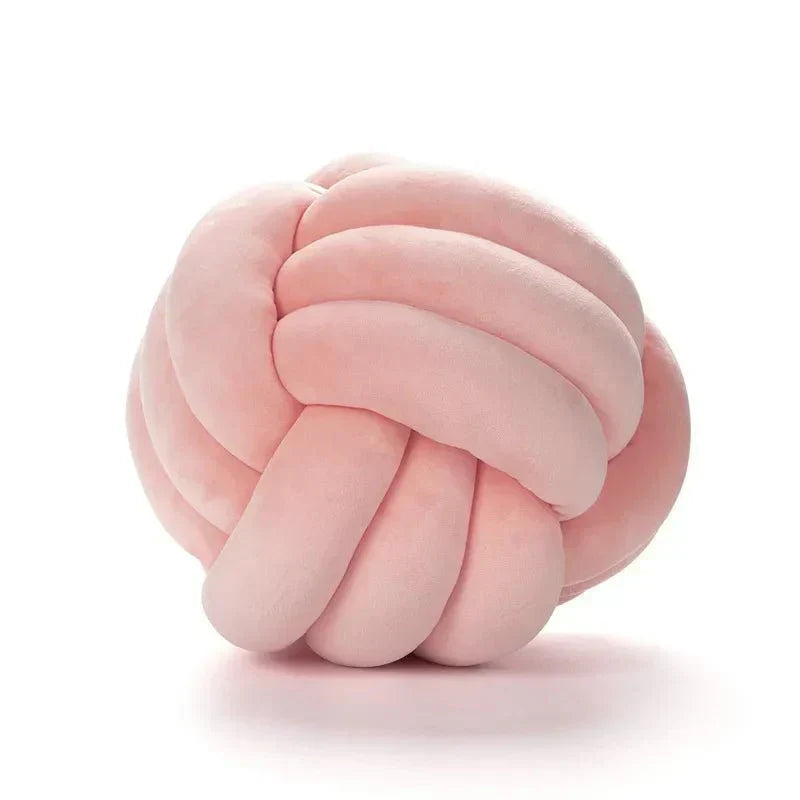 Dekorativ, mjuk kudde med knuten boll i mocka-look
