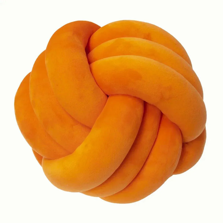 Dekorativ, mjuk kudde med knuten boll i mocka-look