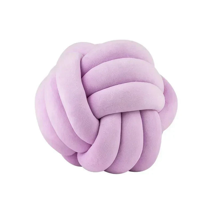 Dekorativ, mjuk kudde med knuten boll i mocka-look